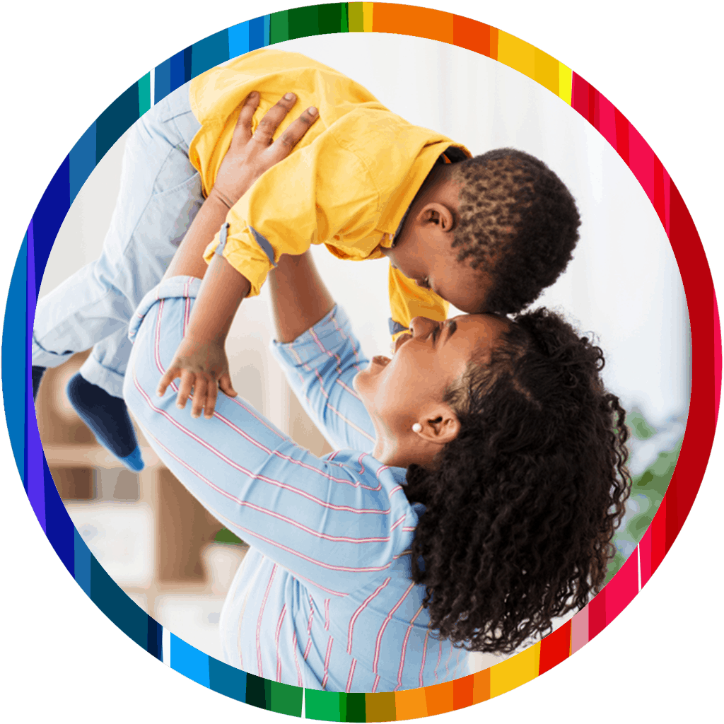 mom holding boy over head_rainbow circle 1024x1024