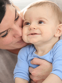 mom kissing smiley baby_216x288