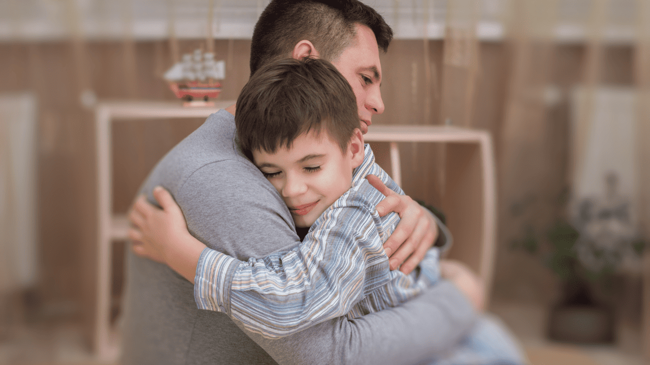 Child hugging father