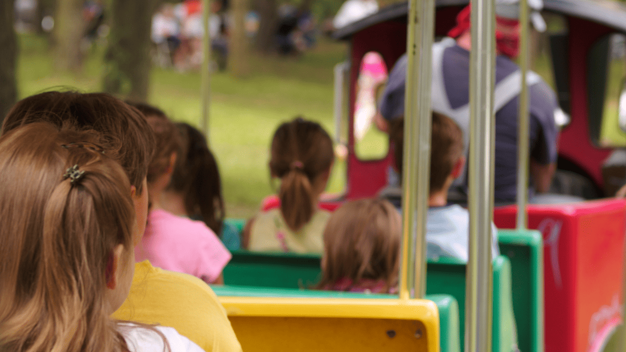 Children playing on toy train